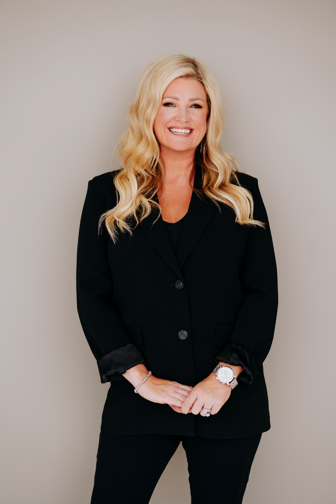 Crystal Standing in black suit